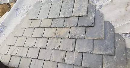 Natural slate roofing tiles being laid A. Dawson Roofing Services Fife