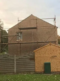 Gable end of a house with scaffolding during roof works A. Dawson Roofing Services Kirkcaldy
